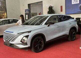 Close-up of 3 Chery car models on display in Vietnam awaiting launch
