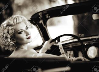 Elegant Lady beside Vintage Car