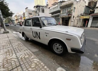 “King of Coffee” Dang Le Nguyen Vu Drives His New Vintage Toyota Corona Down the Street