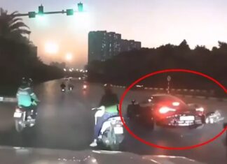 Motorcycle crashes into McLaren supercar, driver potentially liable for millions in damages