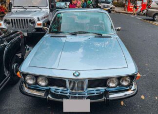 A Vintage BMW 2800CS Cruises the Streets of Saigon