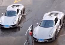 “Luxury Car Owner Carefully Navigates Porsche 918 Spyder Through Puddles”